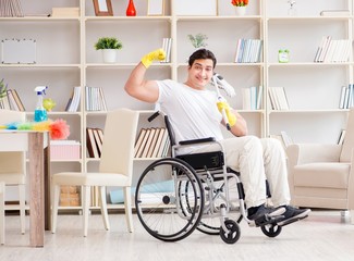 Disabled man cleaning floor at home