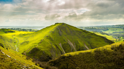 Beautiful View on the Green Hills near river Dove and Stepping Stones at Dovedale in the English Peak District National Park