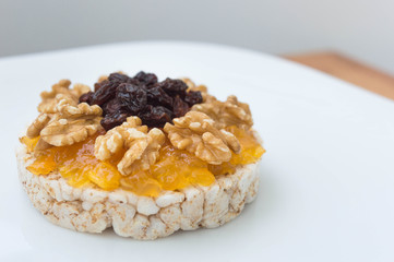  Rice biscuit with papaya candy, nuts and raisins.