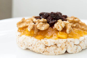  Rice biscuit with papaya candy, nuts and raisins.
