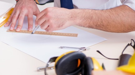 Architect working in his studio on new project