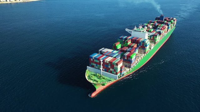 Aerial drone tracking video of Container cargo Ship carrying load in truck-size colourful containers cruising the deep blue Pacific ocean