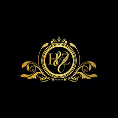 Initial letter HZ logo luxury vector mark, gold color elegant classical symmetric curves decor.