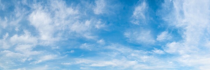 Panorama of blue sky with white clouds as background or texture
