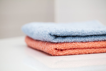 Towels on white table in bath room background.