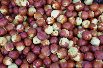 Close-up full frame view of organic jujube fruits displayed at a market stand
