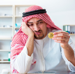 Arab man with bitcoin in cryptocurrency mining concept