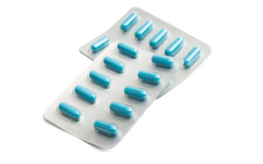 pack of blue capsules isolated