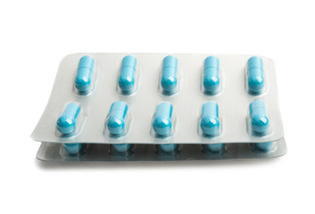 pack of blue capsules isolated