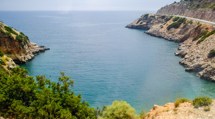 Obraz premium Coastal cliffs of limestone. The coast of Mediterranean Sea in Turkey.