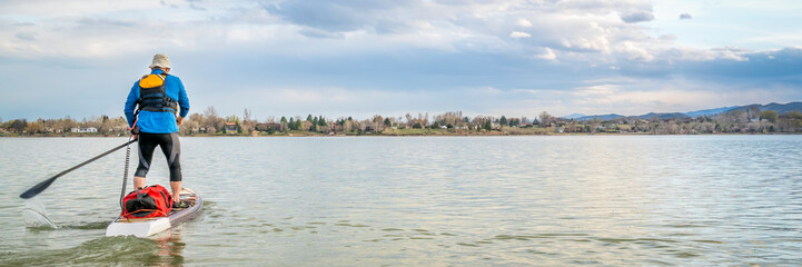 expedition stand up paddleboard on lake