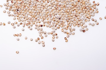 Uncooked raw Sorghum (also known as sorgo) on white background