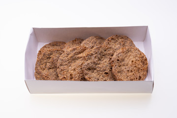 Dried vegan patties in a box isolated on white background