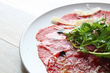 carpaccio on a wooden background