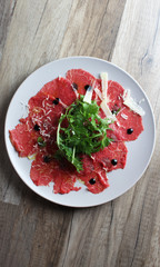 carpaccio on a wooden background