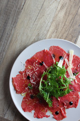 carpaccio on a wooden background