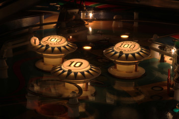 Pinball bumper and coin slot