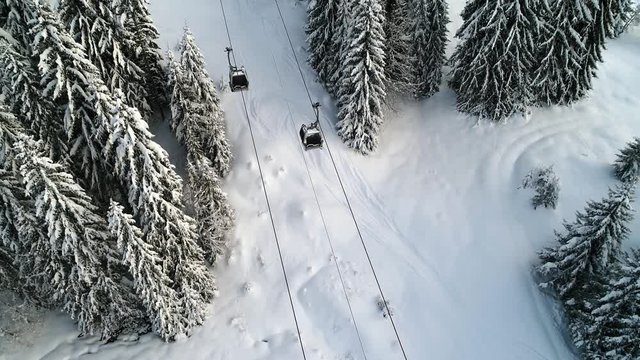 View from above of ski lift gondola in the alps