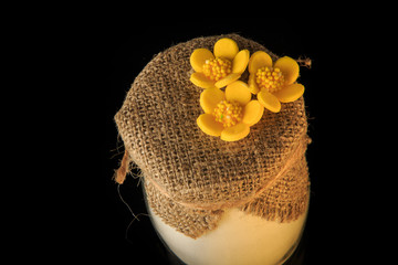 top view closeup small glass jar with white powder