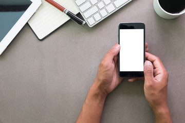 Top view office stuff with notepad, laptop and coffee cup mouse notepad shot.blank screen mobile phone and supplies on white desk workspace and copy space.