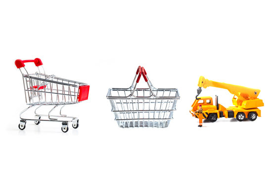 Miniature worker passenger  by truck and forklift to shopping cart and basket isolated on white background ,  Image for shopping online and delivery concept concept.