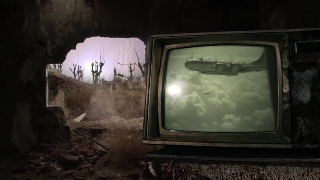War Zone. Old Bomber Dropping an Atomic Bomb in a Destroyed City, as seen on a Retro TV in a Dark Room. Editorial use only. Contains public domain U.S. Army material displayed on screen.