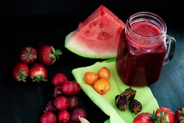 glass of fresh juice and fruits