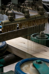 Image of adhesive applied to timber for production