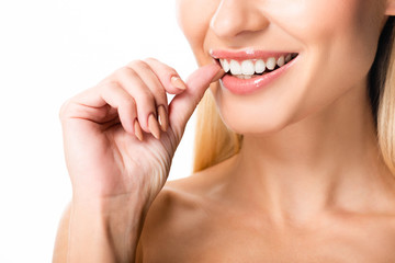 cropped view of naked woman with white teeth isolated on white