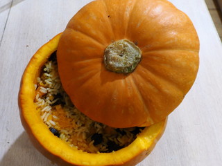 rice with raisins and dried apricots cooked in pumpkin