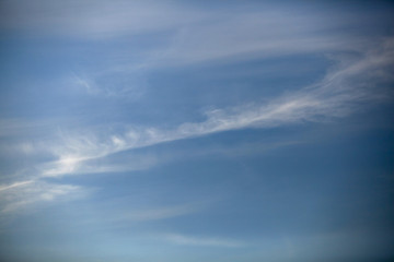 Pure blue sky with streak clouds