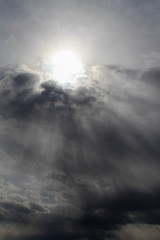 Obraz premium Monochrome sun break thru clouds