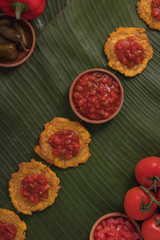 Banana Fritters with Tomato Chutney on top (also known as Patacones in Spanish, famous in Colombia) Post-Production: Rustic feel