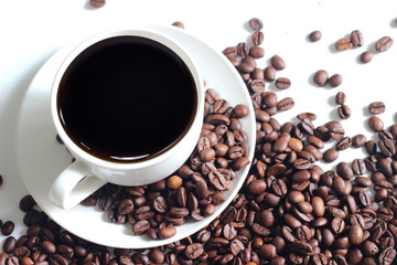 coffee cup with coffee beans isolated on white background