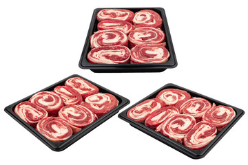 Pieces of fresh raw meat packed in plastic packaging. Ready for sale. White isolated.