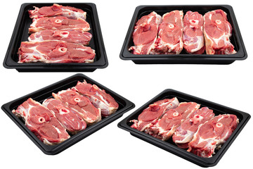 Pieces of fresh raw meat packed in plastic packaging. Ready for sale. White isolated.