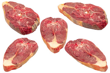 Pieces of raw meat on a white isolated background