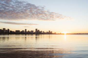 The Perth city skyline at sunrise. Iconic skyline with magical golden light behind it. 