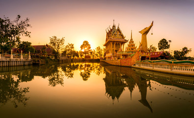 Fototapeta na wymiar Panorama A huge Thai Suphannahong, also called Golden Swan or Phoenix boat at the WatpahSuphannahong Temple twilight time in sisaket, Thailand.Warm tone concept.