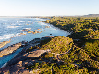 Aerial drone view of an early morning sunrise over the iconic Elephant Rocks and Greens Pool in...