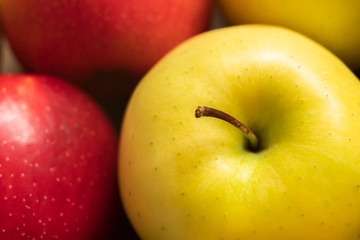 Apples. Extremely close up of yellow and red apples, top view