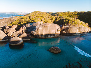The beautiful and iconic elephant rocks in Denmark, Southern Australia. Shot aerially from a drone. Beautiful blue waters with very large and unique boulders along the coastline. 