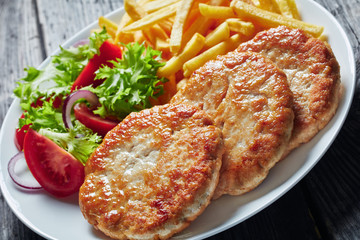 close-up of freshly fried three turkey burgers