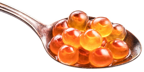 Silver spoon of red caviar on white background. Macro picture.