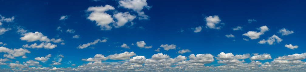 Naklejka na ściany i meble Panorama Sunlight with blue sky on dark background.Vivid sky on white cloud.