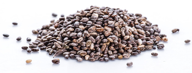 Heap of Chia seeds isolated on white background.