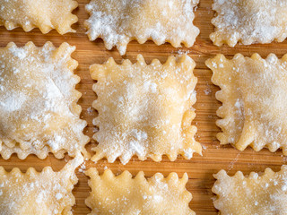 Close Up Top View of Fresh Homemade Ravioli on Wooden Background