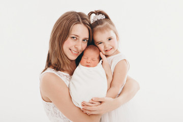 family photo on a white background: woman and boy spend time with children. hug the baby. the...