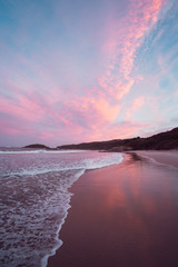 Epic pink and purple sunset over Cosy Corner Beach in Albany, Western Australia. Beautiful vibrant...