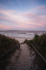 Epic pink and purple sunset over Cosy Corner Beach in Albany, Western Australia. Beautiful vibrant colours in the sky over the beach. 